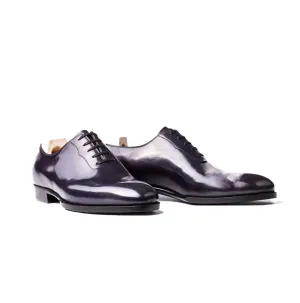 Wholecut Oxford with stitching around the laces in dark purple Crust calf